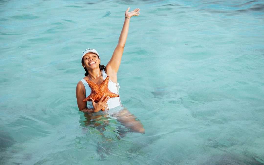Person holding starfish