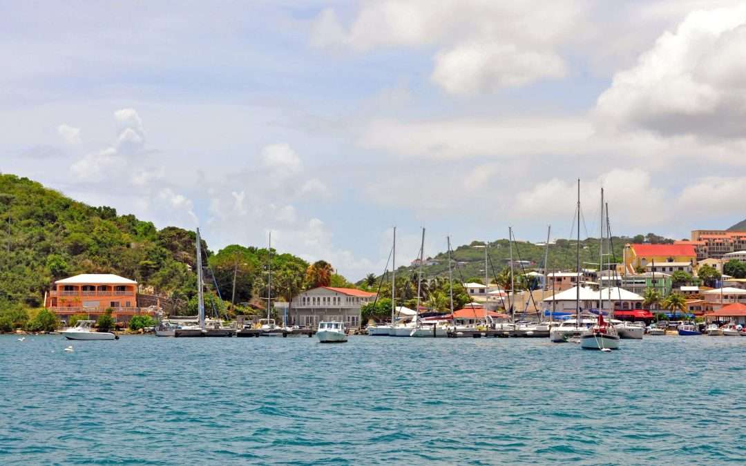 Sail boats near coastal town