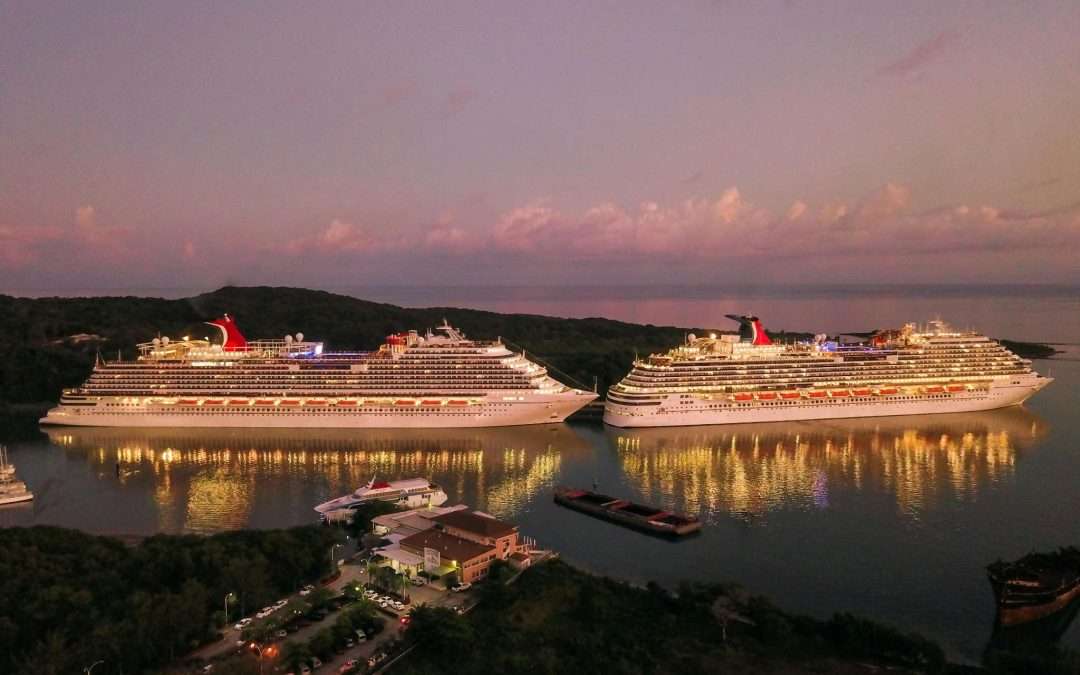 carnival cruise ships docked at sunset